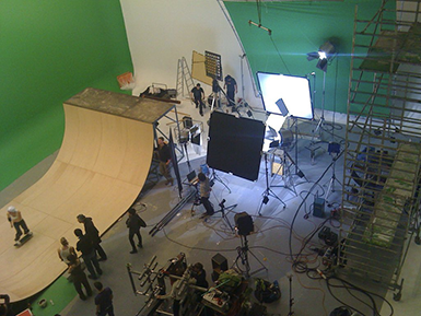 Photo of Austria's largest green screen studio featuring an in-built skate ramp with a skater in action, highlighting the studio's versatility.